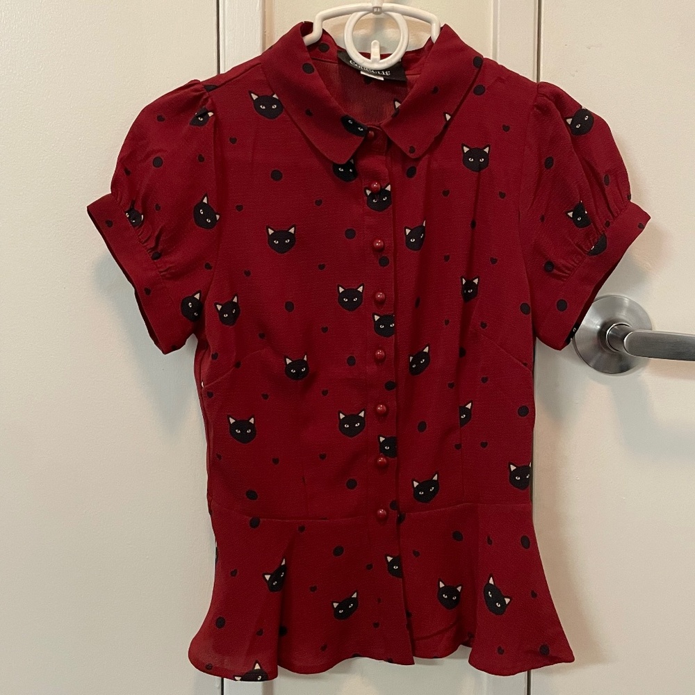 Black cat button up top with peplum